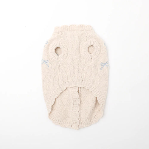 Knitted beige dog sweater on a white background